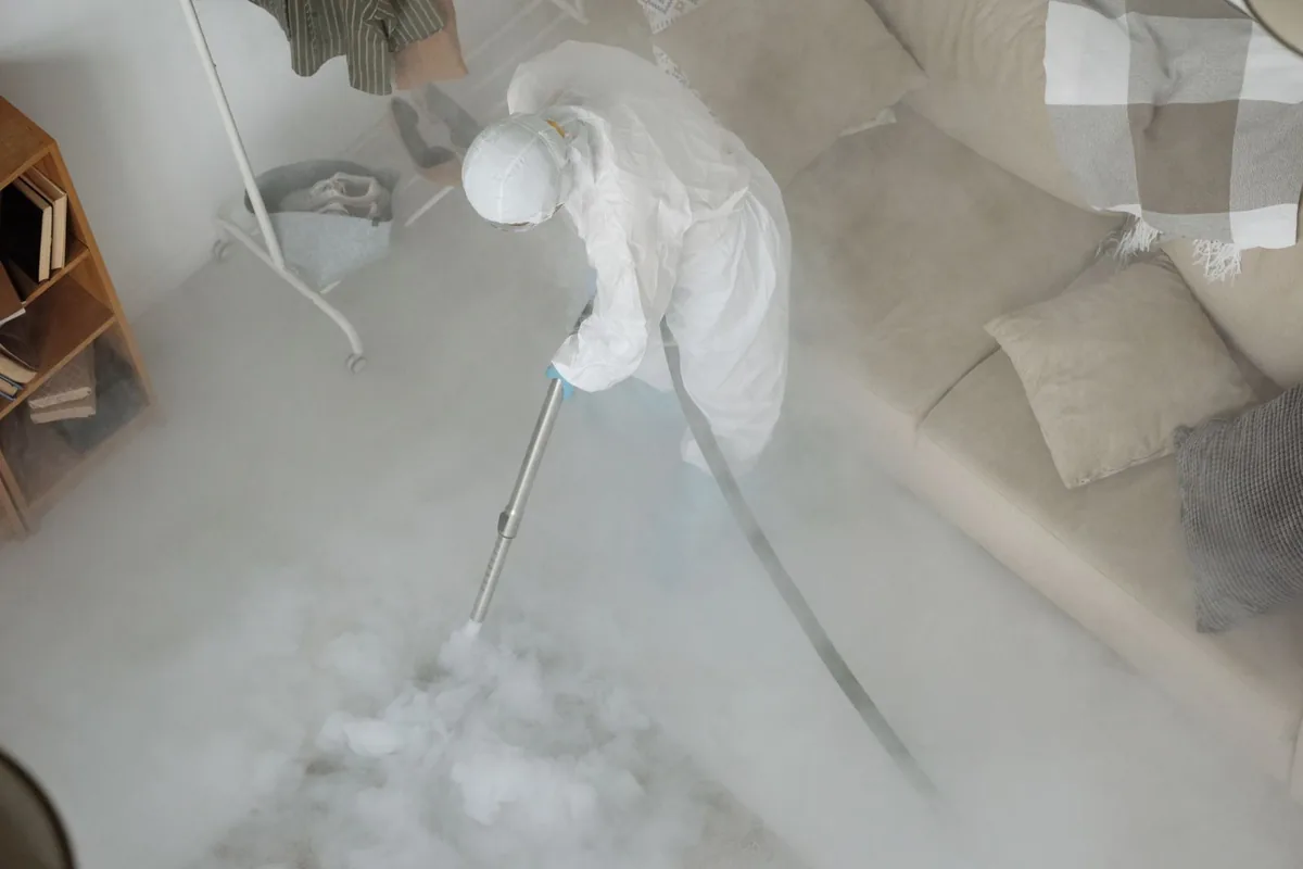 Biohazard cleanup technician in protective equipment, DeFuniak Springs, FL